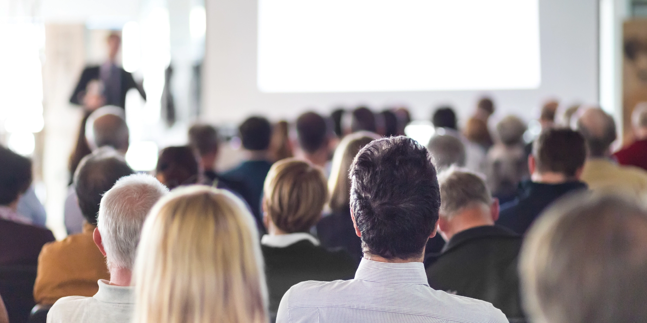 Variety of people at a conference gathering