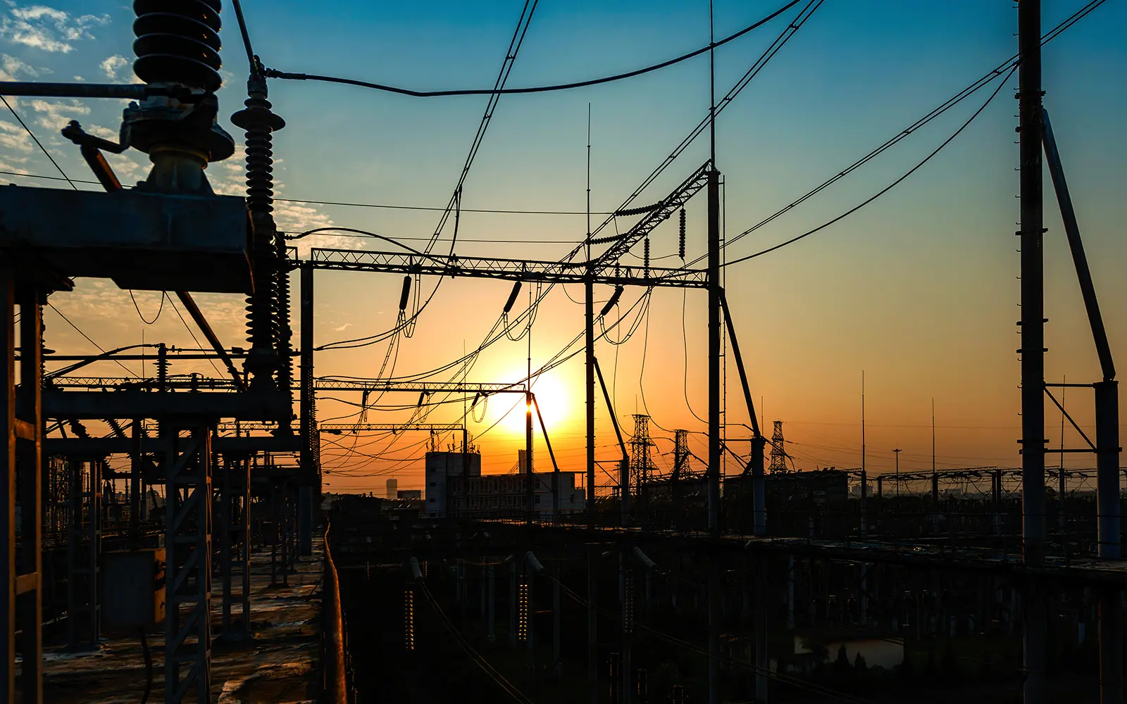 power lines overlooking a sunset