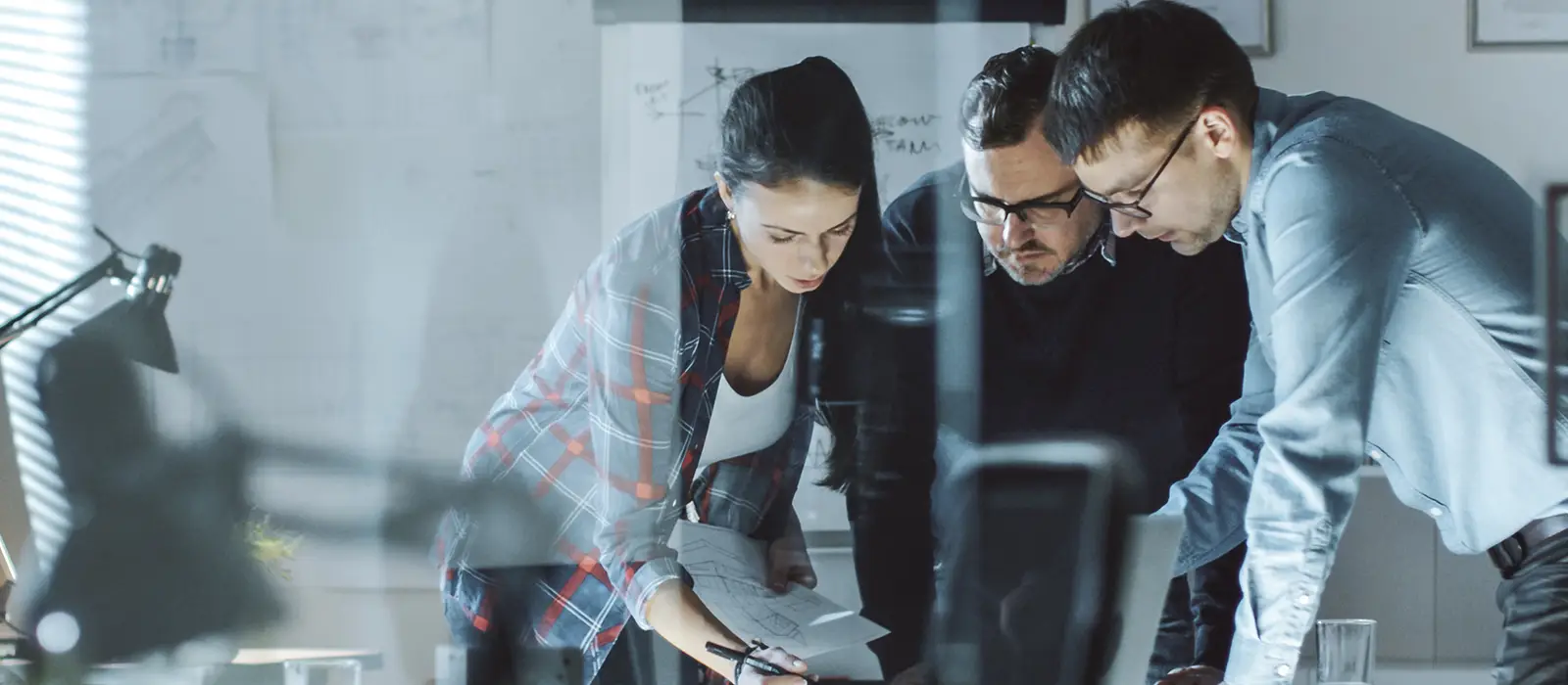 Three Design Engineers Have a Working Meeting about Project