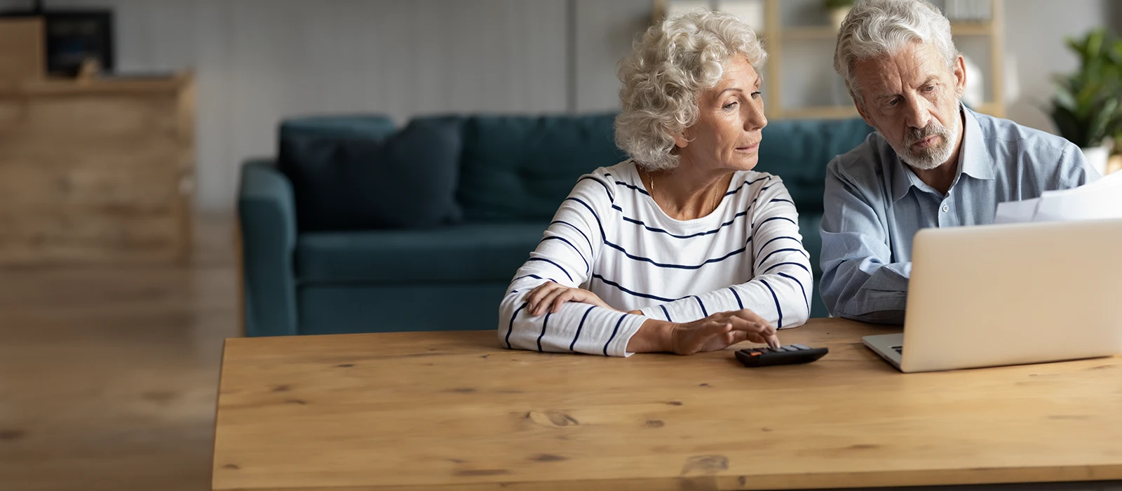 Old couple reviewing paperwork