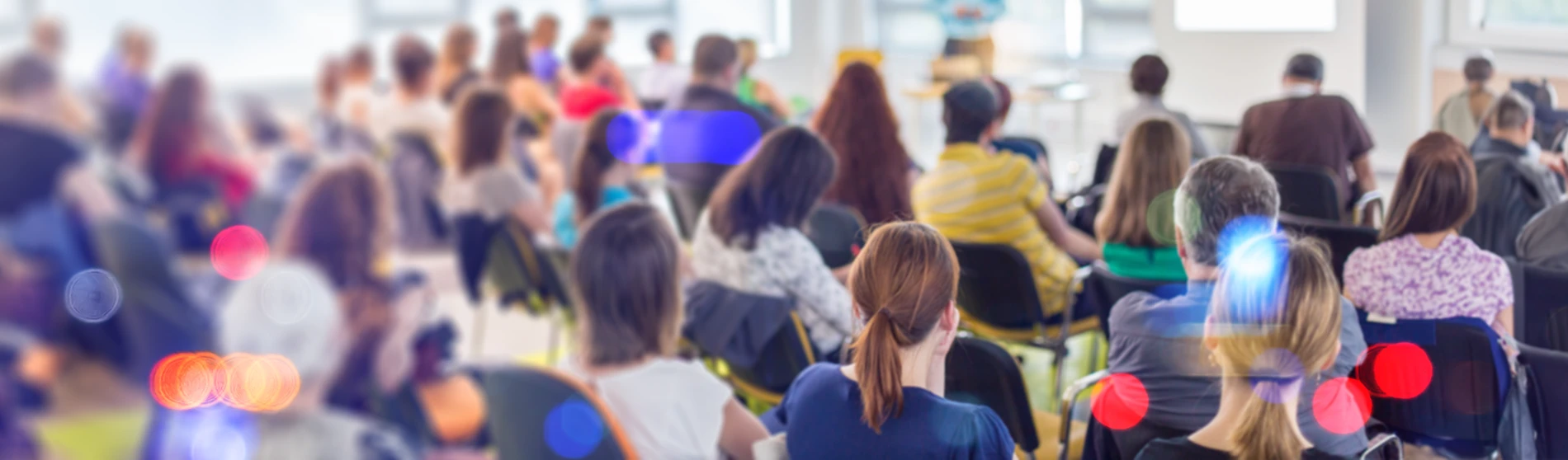 Blurred image of crowd at a conference