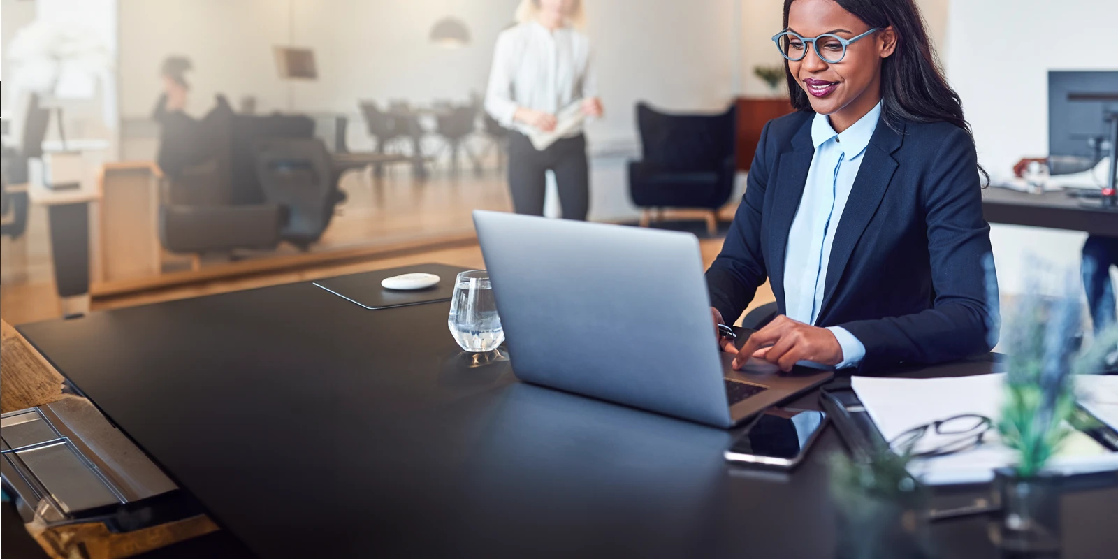 Business woman reviewing financial documents.