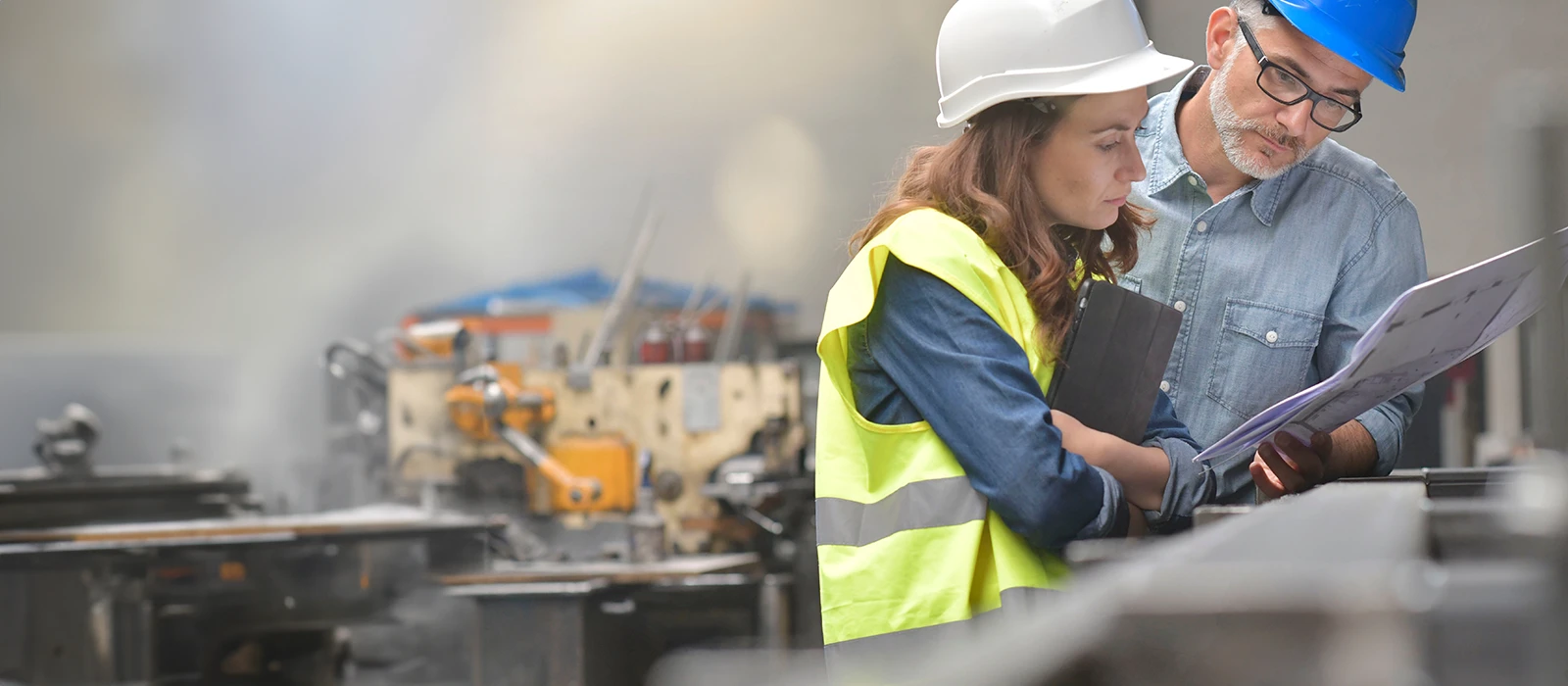 two engineers meeting in factory