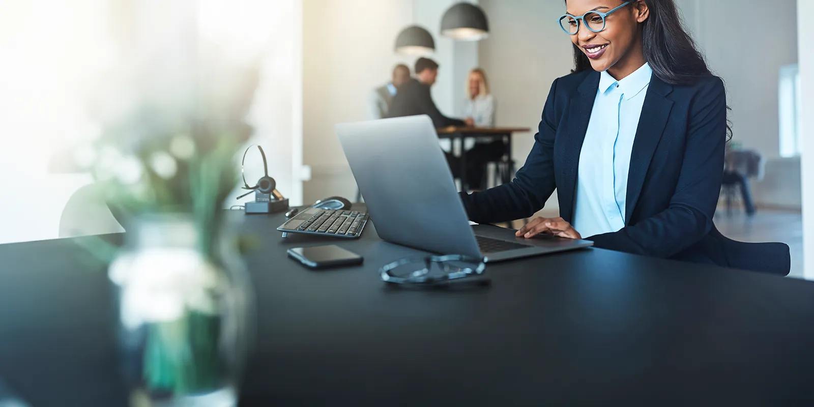 business woman working on a computer in a modern office