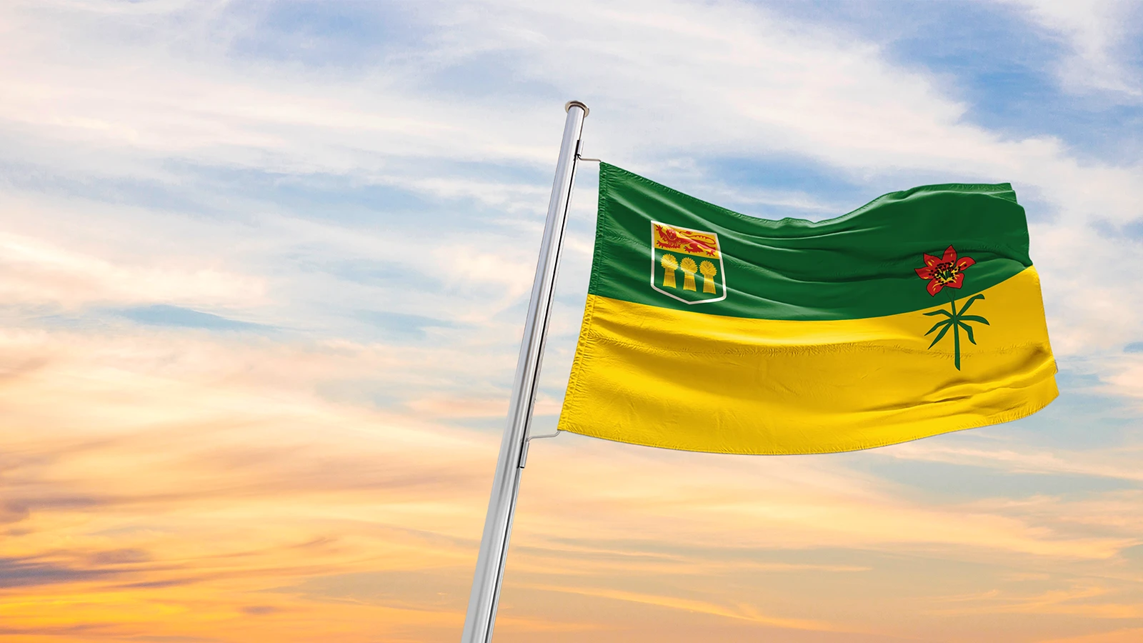 Saskatchewan flag flying over a sunset